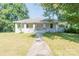 Charming single-story home with a welcoming front porch and well-maintained yard at 1818 Stowe Ave, Gastonia, NC 28054