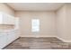 Open concept kitchen with white cabinets, stainless steel appliances, and sleek countertops at 1818 Stowe Ave, Gastonia, NC 28054