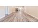 Open-concept living area with modern flooring leading to a kitchen, perfect for entertaining at 1818 Stowe Ave, Gastonia, NC 28054