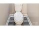 A toilet room with light beige walls and wood-look flooring at 1818 Stowe Ave, Gastonia, NC 28054