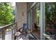 Charming balcony with an Adirondack chair offering a relaxing outdoor space at 2116 Mcclintock Rd # 122, Charlotte, NC 28205