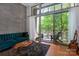 Cozy condo balcony with outdoor seating provides a relaxing escape from a city life with leafy green background at 2116 Mcclintock Rd # 122, Charlotte, NC 28205