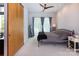 Bright bedroom featuring a ceiling fan, sliding barn door and access to balcony at 2116 Mcclintock Rd # 122, Charlotte, NC 28205
