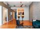 An open floor plan with exposed ductwork, bar seating, and a view into the stylish kitchen at 2116 Mcclintock Rd # 122, Charlotte, NC 28205