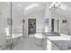 Bright bathroom featuring a soaking tub, glass shower, and modern fixtures at 2312 Selwyn Ave # 502, Charlotte, NC 28207