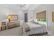 Comfortable bedroom featuring a ceiling fan, large window, and ample space at 2312 Selwyn Ave # 502, Charlotte, NC 28207