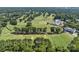 Aerial view of a lush golf course, showcasing the green fairways, sand traps, and the surrounding manicured landscape at 2312 Selwyn Ave # 502, Charlotte, NC 28207
