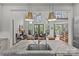Open concept kitchen overlooking dining and living areas with granite countertops at 2312 Selwyn Ave # 502, Charlotte, NC 28207
