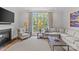 Comfortable living room with fireplace, large windows, and cozy seating at 2312 Selwyn Ave # 502, Charlotte, NC 28207