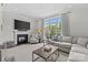 Spacious living room with a fireplace, large windows, and modern decor at 2312 Selwyn Ave # 502, Charlotte, NC 28207