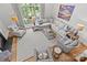 Bright living room featuring a plush sofa, stylish chairs, hardwood floors, and large windows at 2312 Selwyn Ave # 502, Charlotte, NC 28207