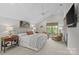 Cozy main bedroom with a plush bed, stylish sitting area, and serene natural light at 2312 Selwyn Ave # 502, Charlotte, NC 28207