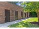 Photo of storage units with a brick exterior and individual metal doors for secure and easy access at 2312 Selwyn Ave # 502, Charlotte, NC 28207
