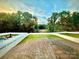 Expansive backyard with a white fence, lush green lawn, trees and a swimming pool at 243 Kerri Dawn Ln, Locust, NC 28097