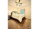 Cozy bedroom with a padded headboard, decorative pillows, and a nightstand with a lamp at 243 Kerri Dawn Ln, Locust, NC 28097