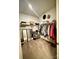 Walk-in closet providing ample storage space, featuring racks and shelving at 243 Kerri Dawn Ln, Locust, NC 28097