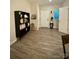 Inviting entryway showcasing stylish decor, a storage shelf and durable wood-look flooring at 243 Kerri Dawn Ln, Locust, NC 28097