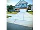 Charming two-story home with a well-manicured lawn and a two-car garage at 243 Kerri Dawn Ln, Locust, NC 28097