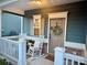 Charming front porch featuring rocking chairs, stylish decor, and a welcoming atmosphere at 243 Kerri Dawn Ln, Locust, NC 28097