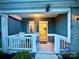 Inviting porch with rocking chairs and a view into an open front door at 243 Kerri Dawn Ln, Locust, NC 28097