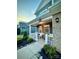 Inviting front porch with rocking chairs and manicured landscaping for a cozy curb appeal at 243 Kerri Dawn Ln, Locust, NC 28097