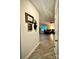 Hallway view leading to the living room with modern decor and wood-look flooring at 243 Kerri Dawn Ln, Locust, NC 28097