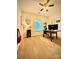 Bright home office with a large desk, ceiling fan, carpet and natural light at 243 Kerri Dawn Ln, Locust, NC 28097