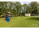 Backyard featuring a play set and storage shed, providing a fun and practical outdoor space at 2460 Prince Dr, Lancaster, SC 29720