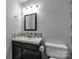 Modern bathroom featuring black fixtures, a sleek sink, and tiled backsplash at 2460 Prince Dr, Lancaster, SC 29720