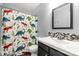 Modern bathroom featuring a decorative shower curtain, a dark vanity, and tiled backsplash at 2460 Prince Dr, Lancaster, SC 29720