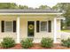 Close-up of a charming front porch with decorative touches and a welcoming entrance at 2460 Prince Dr, Lancaster, SC 29720