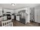 Modern kitchen with white cabinets, stainless steel appliances, and a convenient laundry area at 2460 Prince Dr, Lancaster, SC 29720