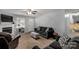 Well-lit living room showcasing comfortable seating, neutral tones, and a cozy atmosphere at 2460 Prince Dr, Lancaster, SC 29720
