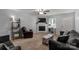 Comfortable living room featuring a fireplace, stylish decor, and ample natural light at 2460 Prince Dr, Lancaster, SC 29720