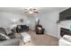 Cozy living room with neutral paint, plush seating, and a fireplace, perfect for relaxing at 2460 Prince Dr, Lancaster, SC 29720