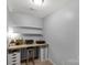 Bright room featuring built-in desk with storage and floating shelves at 2460 Prince Dr, Lancaster, SC 29720