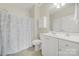 Bathroom featuring a shower with a curtain, white vanity, and a mirror over the sink at 2959 Bellasera Way, Matthews, NC 28105