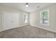 Carpeted bedroom with double door closet and a large window providing natural light at 2959 Bellasera Way, Matthews, NC 28105