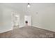 Spacious bedroom with wall to wall carpeting, neutral paint, and views of the bathroom at 2959 Bellasera Way, Matthews, NC 28105