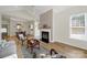 Inviting living room with fireplace, vaulted ceiling, and seamless transition to dining area at 2959 Bellasera Way, Matthews, NC 28105