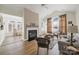 Cozy living room featuring a fireplace, vaulted ceiling, and neutral decor at 2959 Bellasera Way, Matthews, NC 28105