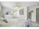 Bedroom with carpeted floors, white furniture, a ceiling fan, and bright natural light at 3020 Fallondale Rd, Waxhaw, NC 28173