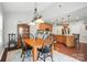 Dining room featuring a classic wood table, seating for six, a large hutch, and an open view to the kitchen at 3020 Fallondale Rd, Waxhaw, NC 28173