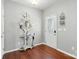 Elegant entry room with hardwood floors, a vintage mirror, and a decorative coat rack at 3020 Fallondale Rd, Waxhaw, NC 28173