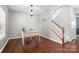 Elegant entry room with hardwood floors, a vintage desk, and a staircase at 3020 Fallondale Rd, Waxhaw, NC 28173