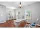Elegant entry room with hardwood floors, a vintage desk, and ample natural light at 3020 Fallondale Rd, Waxhaw, NC 28173