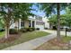 Charming two-story home with a covered front porch, stone accents, and an attached two-car garage at 3020 Fallondale Rd, Waxhaw, NC 28173