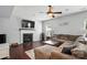 Comfortable living room features a decorative fireplace and lots of light at 3020 Fallondale Rd, Waxhaw, NC 28173