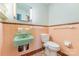 Vintage-style bathroom featuring unique sink, toilet, and tile design at 330 S Ellis St, Salisbury, NC 28144
