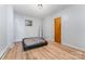 Spare bedroom with hardwood floors, neutral walls, and a single door at 330 S Ellis St, Salisbury, NC 28144